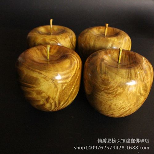 金丝楠木与黄金樟的完美邂逅 满瘤疤水波影苹果摆件品鉴